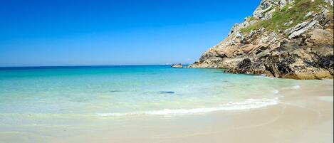 On the beach, sun-loungers