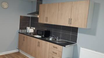 Apartment, Multiple Beds | Private kitchen | Fridge, microwave, stovetop, electric kettle