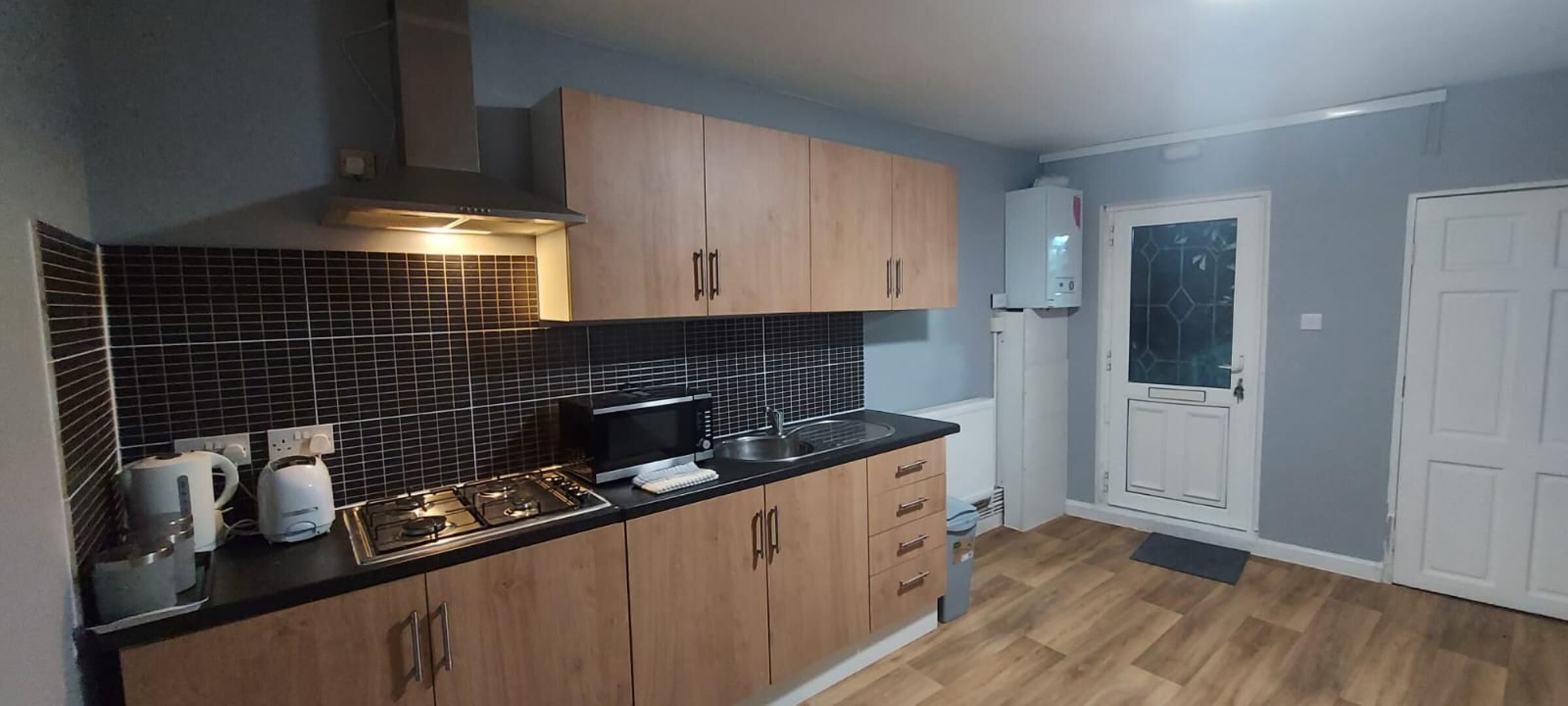 Apartment, Multiple Beds | Private kitchen | Fridge, microwave, stovetop, electric kettle