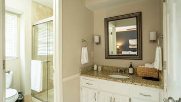 Combined shower/bathtub, hair dryer, towels, soap