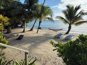 On the beach, sun loungers, beach towels - Beachfront Home with 3 Private Units • Perfect for Couples or Families (Maya Beach)