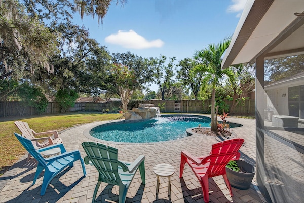 Poolside seating with colorful chairs, perfect for relaxing