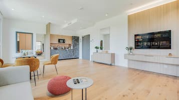 Penthouse Suite with balcony and terrace. | Living area | 50-inch Smart TV with digital channels, TV, Netflix