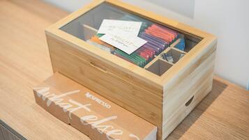 A wooden box with a glass front containing various items.