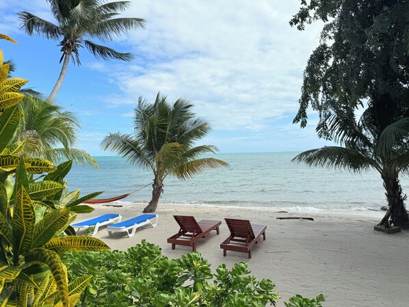 On the beach, sun loungers, beach towels