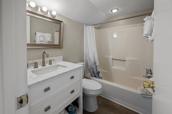 A bathroom with a sink, mirror, and toilet. - Richmond Pk 20F in Kingston 2nd floor, Pool, Beach (Myrtle Beach)