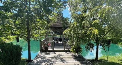 BACKYARD OASIS! Cozy and charming 60s Brick ranch with relaxing gazebo over pond