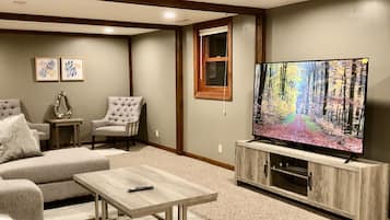 Deluxe House | Living area | 70-inch Smart TV with digital channels, TV