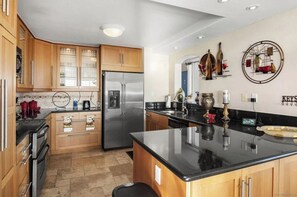 Fridge, microwave, oven, stovetop - Beach front condo on the harbor in Oceanside marina tower (Oceanside)