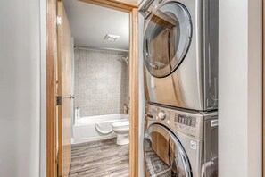 Combined shower/tub, hair dryer, towels, soap