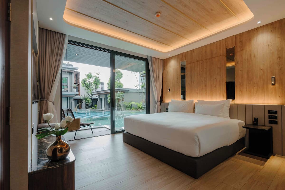 Pool Access Room | 1 bedroom, free minibar, in-room safe, individually decorated