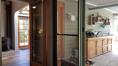 Adorable Guest House with fireplace in forest setting. One or two Queen Beds.