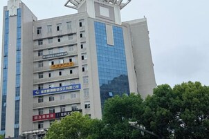 A multi-story building with signage indicating various services.
