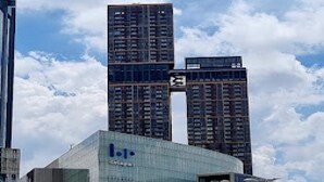 A modern building with a glass facade and a sign that reads "Hotel". - GOLDEN PALACE HOTEL (Kuala Lumpur)