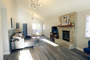 TV, fireplace, books