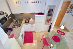 Fridge, microwave, stovetop, coffee/tea maker
