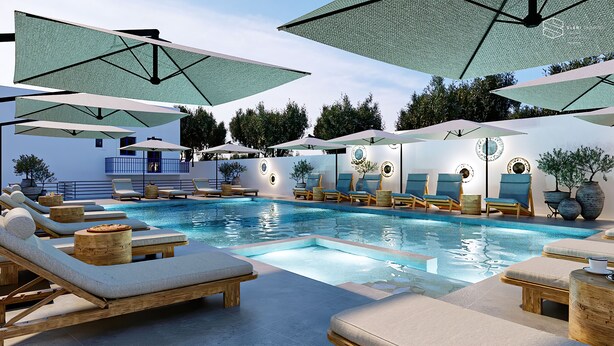 A poolside area with lounge chairs, umbrellas, and a swimming pool. - Cretan Seaside Boutique Hotel (Hersonissos)