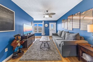 Family House, 3 Bedrooms, Balcony, Beach View | Living room | 50-inch Smart TV with cable channels, TV