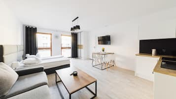 1 habitación, sistema de insonorización y tabla de planchar con plancha