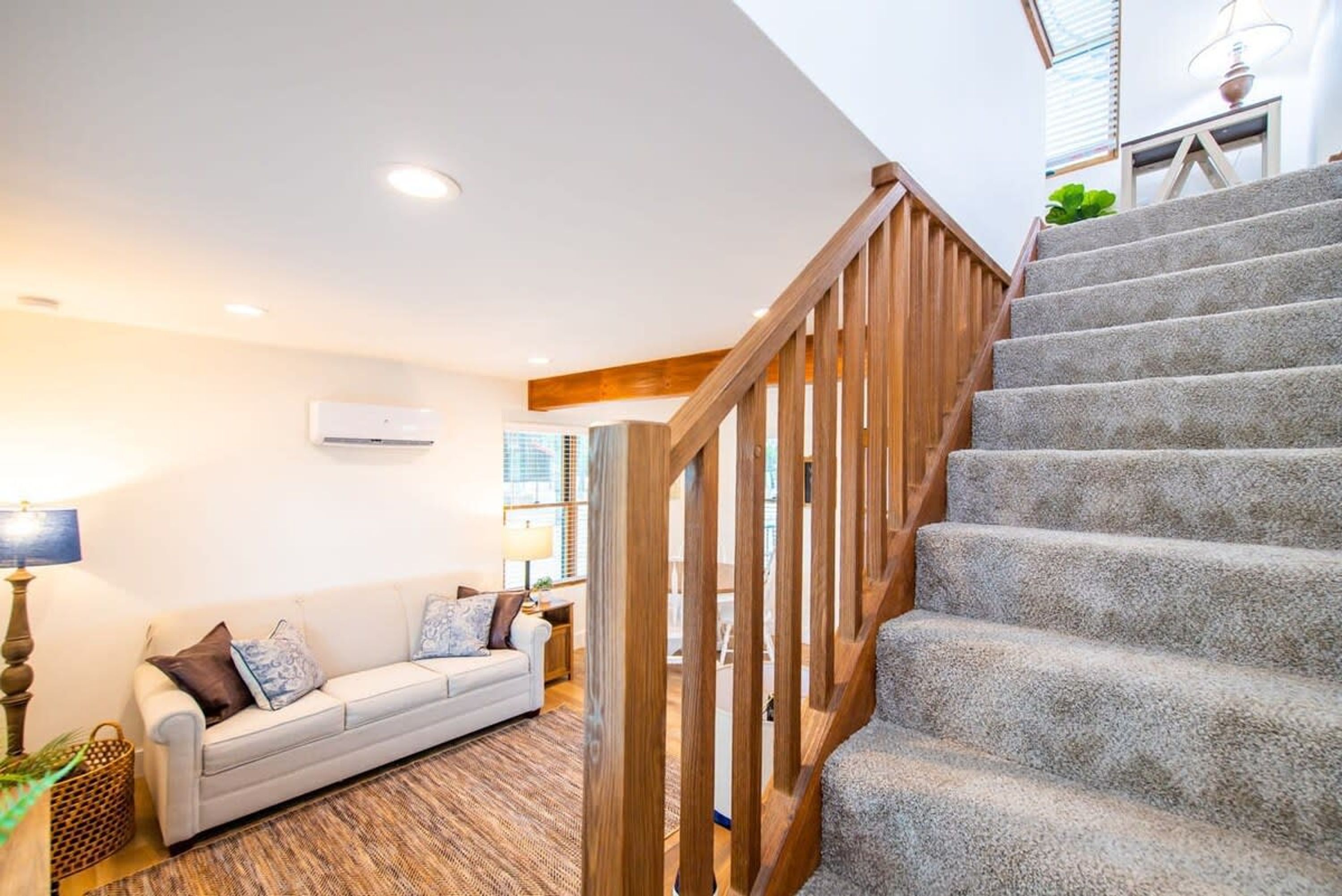 A staircase with wooden railings leading to an upper floor.