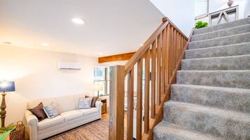 A staircase with wooden railings leading to an upper floor.