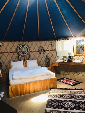 Desk, laptop workspace, bed sheets