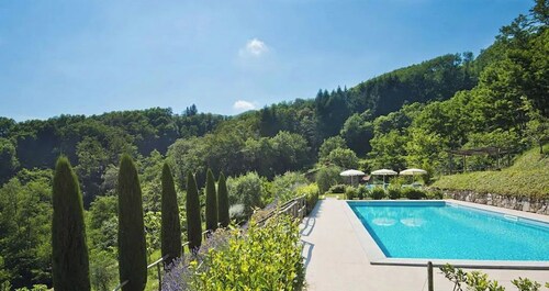 Design house in Tuscan style surrounded by nature