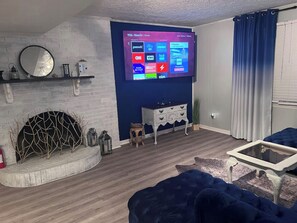 Smart TV, fireplace, books