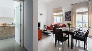 A modern apartment with a kitchen, dining area, and living space. - 22 - Unique Four Bedroom Townhouse by PMI Malta (Tas-Sliema)