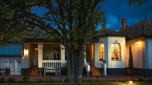 A two-story house with a porch and a tree in front. - Treasure Of The Past With Whirlpool (Balatonrendes)