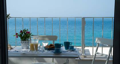 Beachfront 2nd floor apartment with terrace located east with sunset
