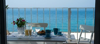 Beachfront 2nd floor apartment with terrace located east with sunset