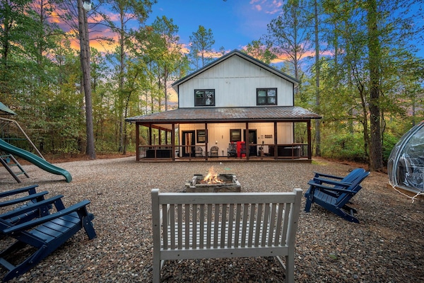 Your ultimate backyard cabin in the woods! Fire pit, Hypedome, playground, and hot tub and dining right off the covered back deck.