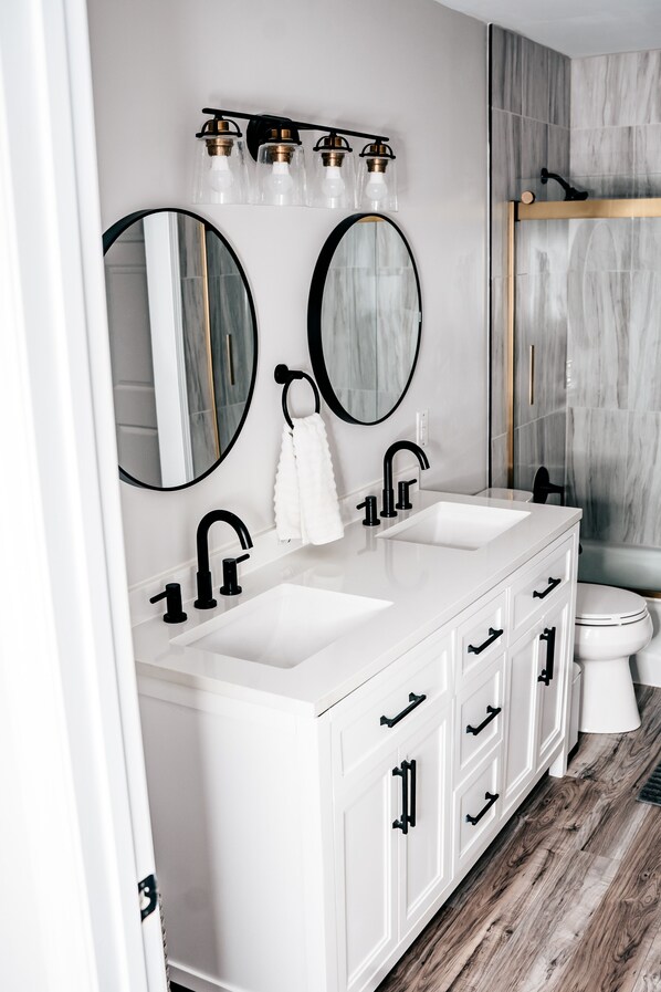 Combined shower/tub, hair dryer, towels, toilet paper