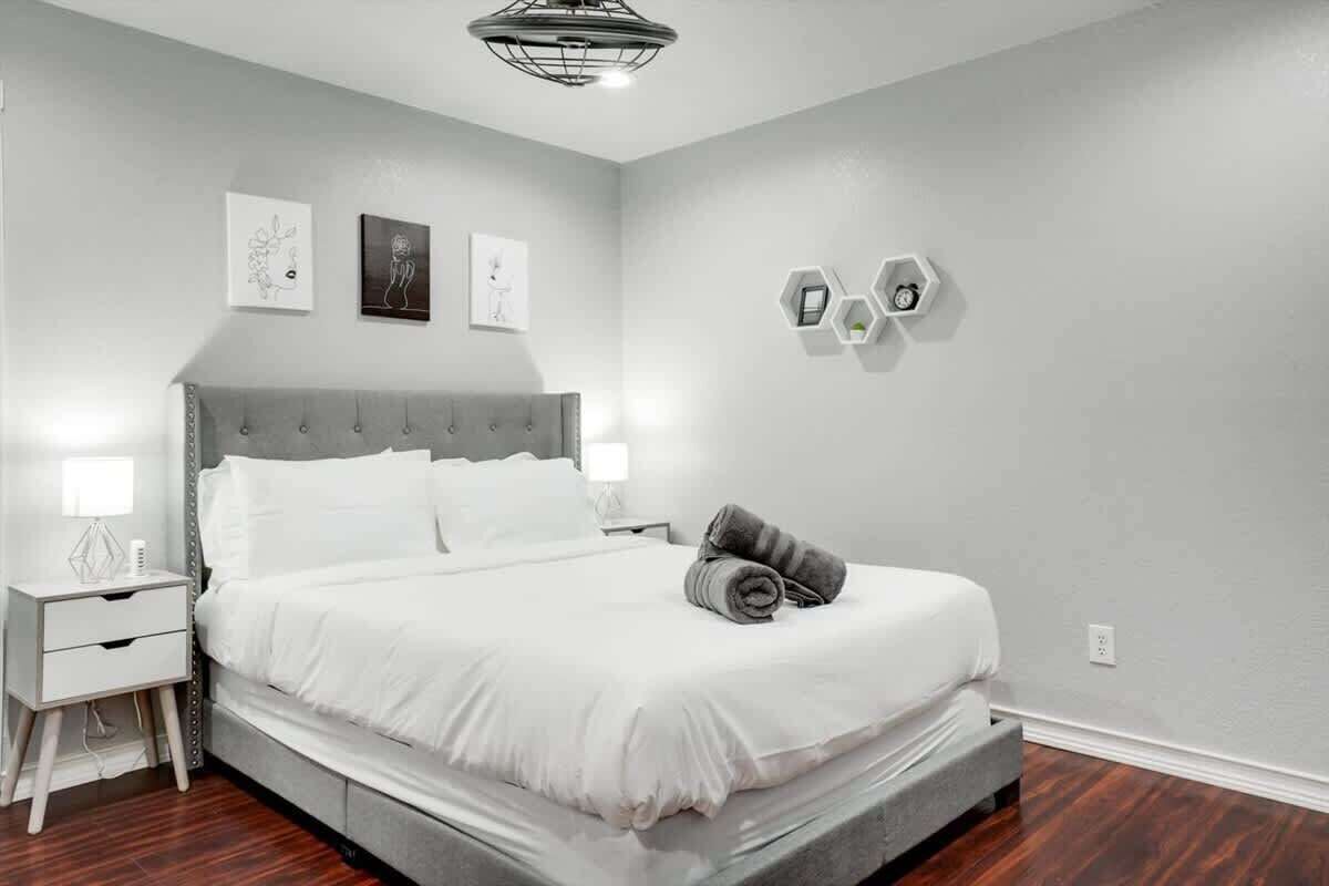 Rest comfortably in Bedroom 3, featuring a queen bed on the second floor and bedside lighting for winding down.
