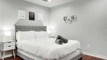 Rest comfortably in Bedroom 3, featuring a queen bed on the second floor and bedside lighting for winding down.