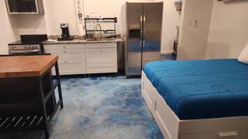 1 bedroom, desk, iron/ironing board, travel crib