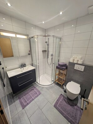 Shower, hair dryer, towels, soap