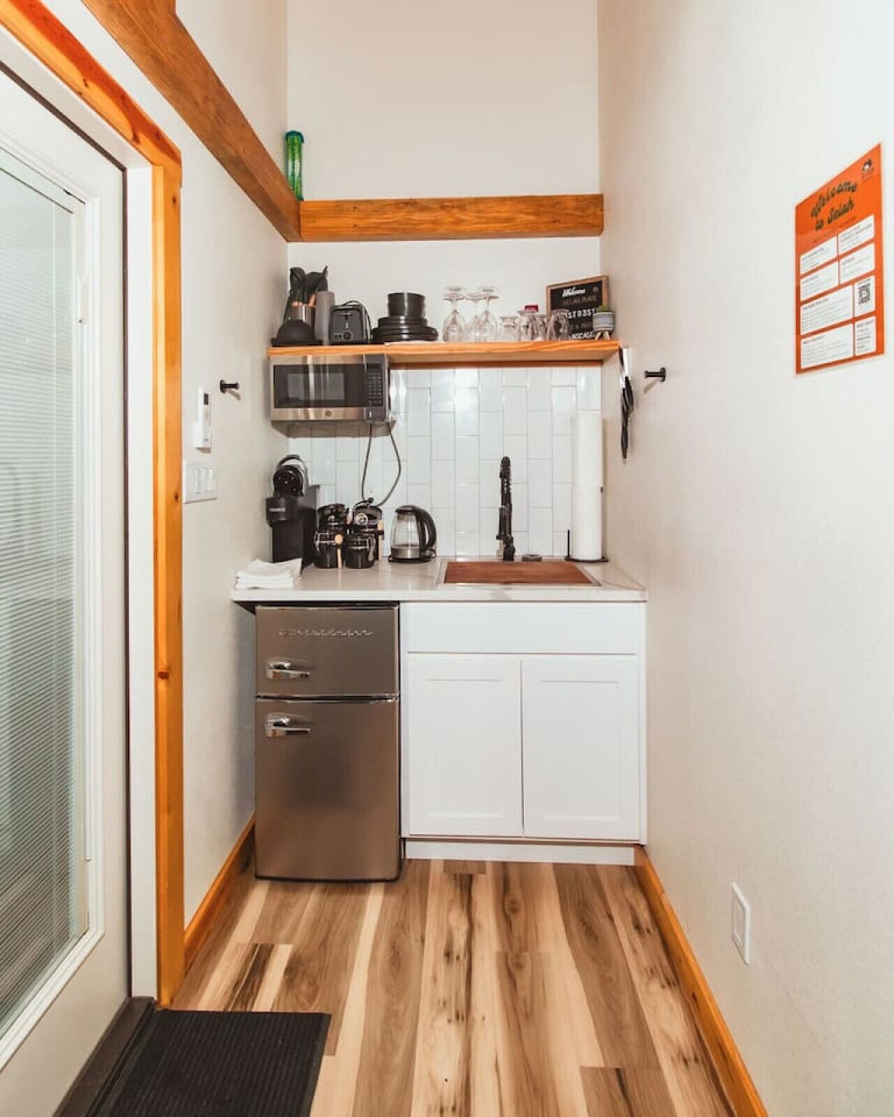 Fridge, microwave, coffee/tea maker, cookware/dishes/utensils