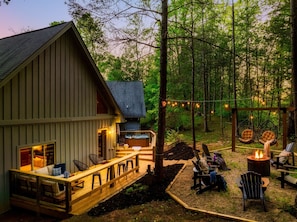 A cabin with a deck, outdoor seating, and a fire pit. - ~Fall Sale~Luxury~LogCabin~RockyTopSports~135inTheater~HotTub~GameRoom~Firepit (Gatlinburg)