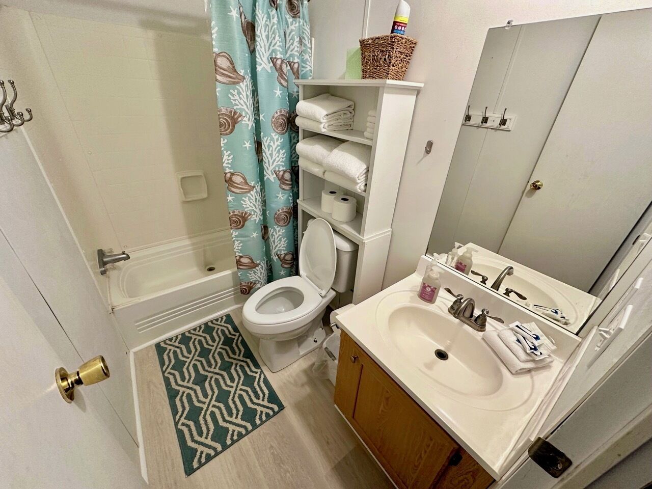 Combined shower/bathtub, towels, soap