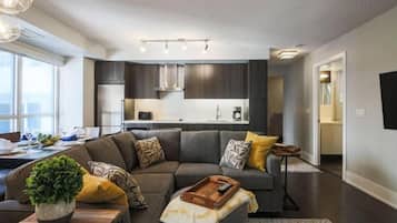 Family Apartment | Living area | 42-inch flat-screen TV with cable channels