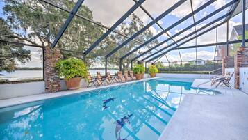 Relax by the pool surrounded by lush views and elegant architecture.