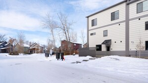 A residential area with snow-covered ground and houses. - Industrial Retreat Where Recreation Abounds! Dogs OK, Pool Table, BBQ & More! (Bozeman)