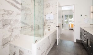 Bathtub, hair dryer, towels, soap
