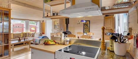 Fridge, stovetop, dishwasher, coffee/tea maker