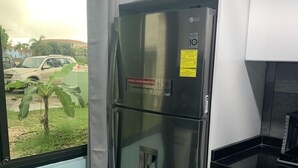A stainless steel refrigerator with a water dispenser, a built-in ice maker, and a freezer compartment. - NEWLY RENOVATED Ocean Front 2 bedroom/ 2 bath, pristine water, divers paradise. (Kralendijk)