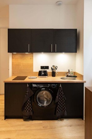 Fridge, microwave, coffee/tea maker, dining tables