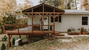 A cabin with a wooden deck, a front door, and a window. - Antique Charm 8 Mins to Stratton 12 to Mt Snow (Stratton)