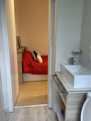 Shower, towels, soap, toilet paper